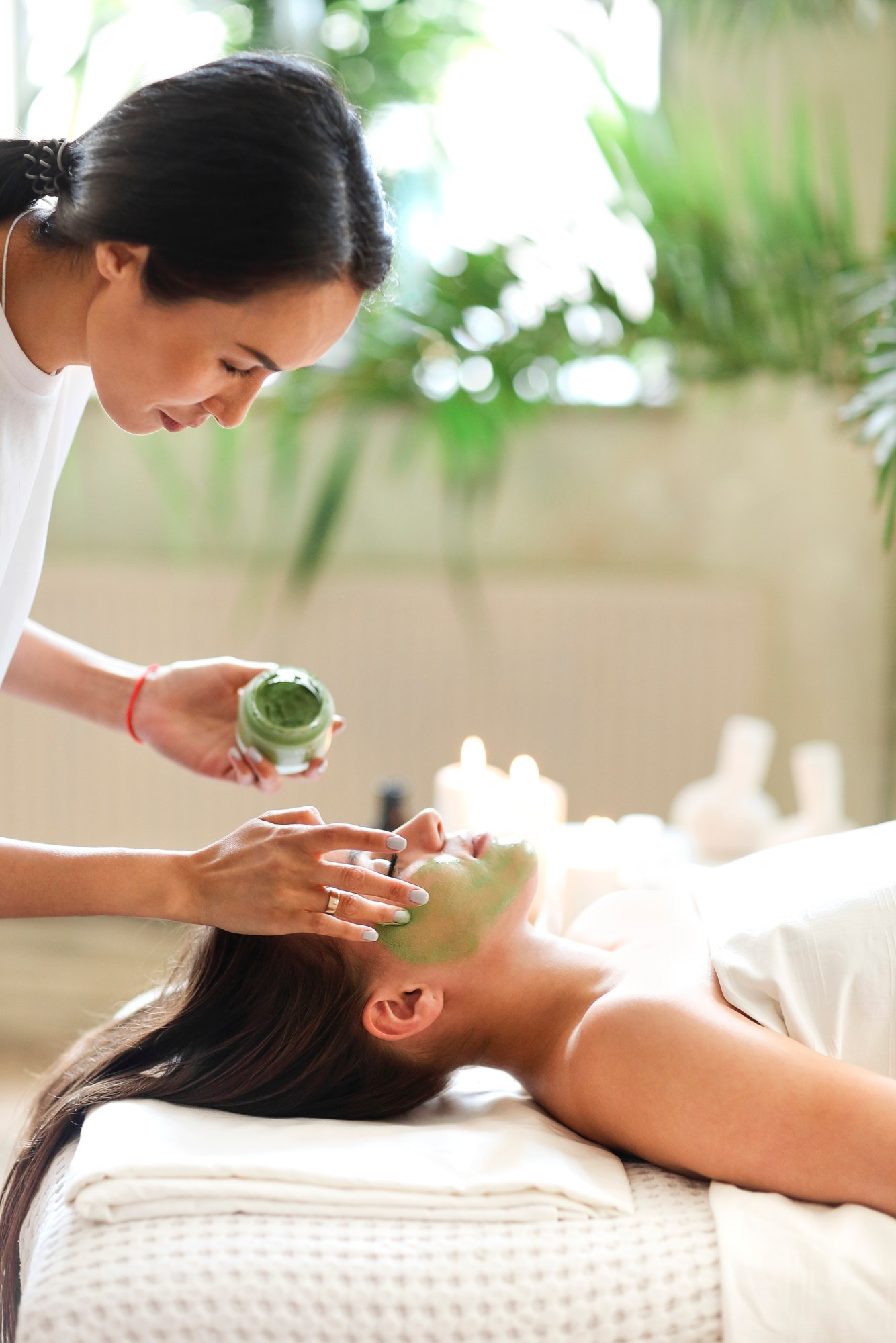 beautiful-relaxed-woman-having-green-clay-face-mask-in-spa-salon.jpg